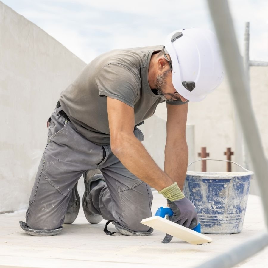 Roofing contractor sealing edges with waterproofing tape in Hidden Hills.