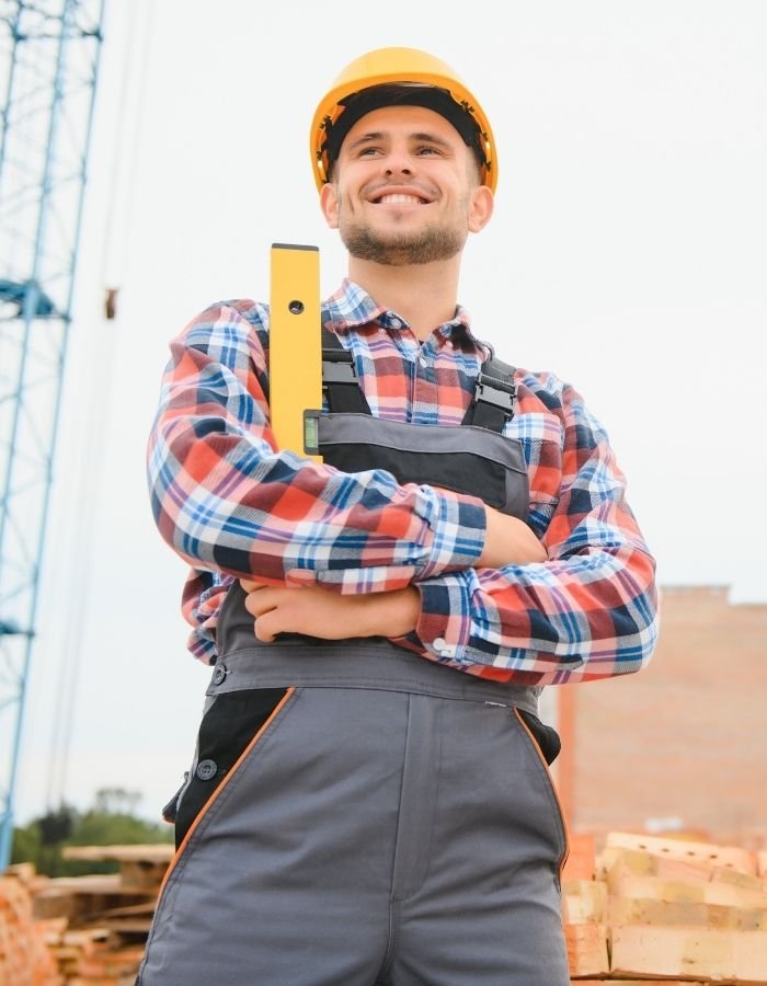 Los Angeles roofing contractor smiling on the job during residential roof installation.