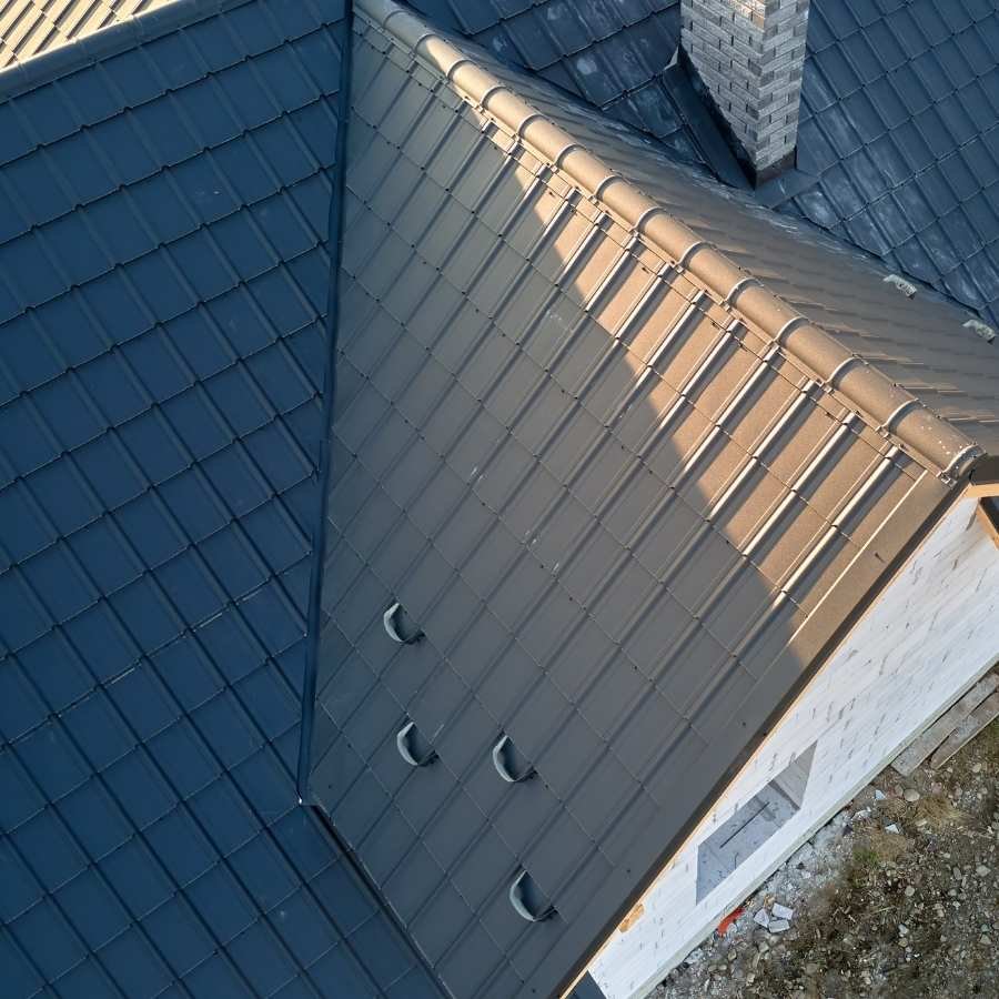 Aerial view of a home featuring modern metal roofing in Hidden Hills.