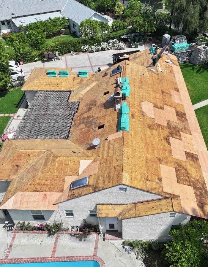 Roof replacement underway with exposed plywood decking in Los Angeles roofing project