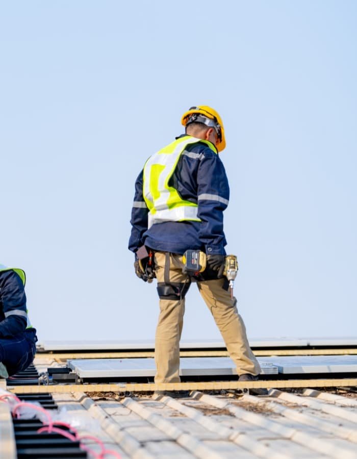 Experienced roofer in Los Angeles inspecting a residential roof